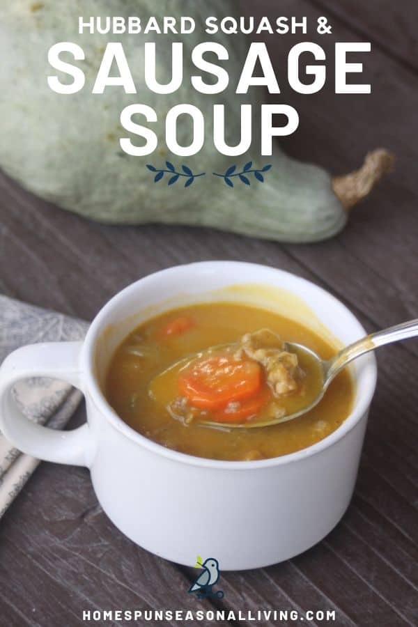 Hubbard squash sausage soup in a white cup with spoon and napkin. 