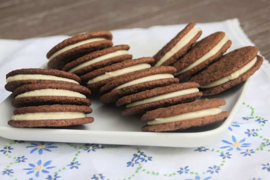 a platter full of mocha sandwich cookies.