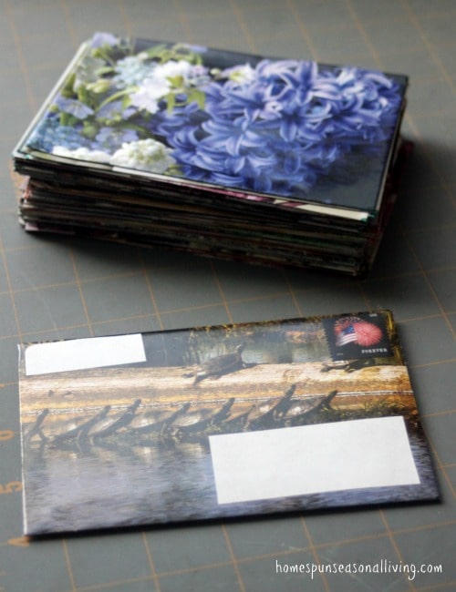 Handmade envelopes stacked on a table.