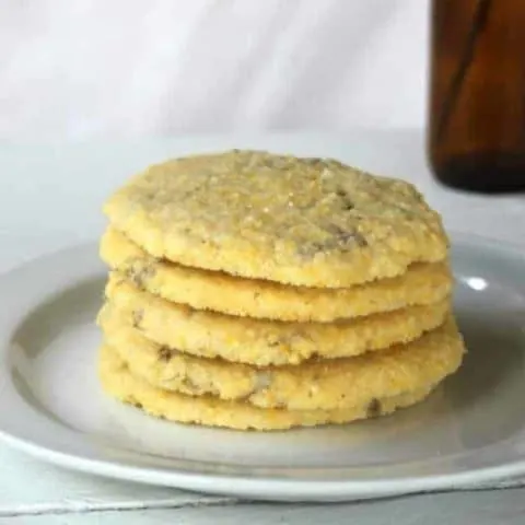 lilac cornmeal cookies on a plate.