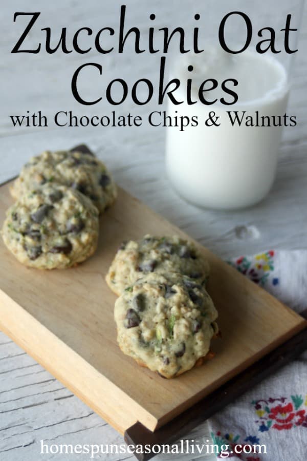 Zucchini Oat Chocolate Chip Cookies on a wooden platter with a glass of milk.