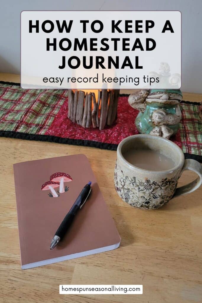 A journal with a drawing of mushrooms on the cover sits on a table with a pen on top of it. A cup of coffee sits to the right and a table runner with a lit candle is in the background. 