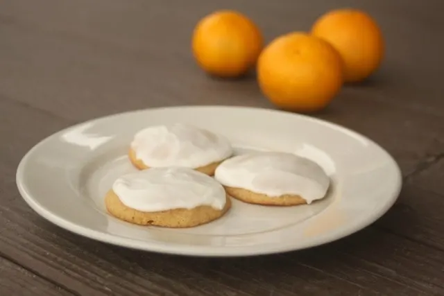 These frosted orange cookies are sure to please adults and kids alike with their soft and airy texture topped with a creamy icing.