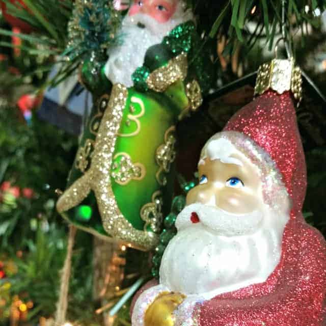 Santa ornaments on a christmas tree.