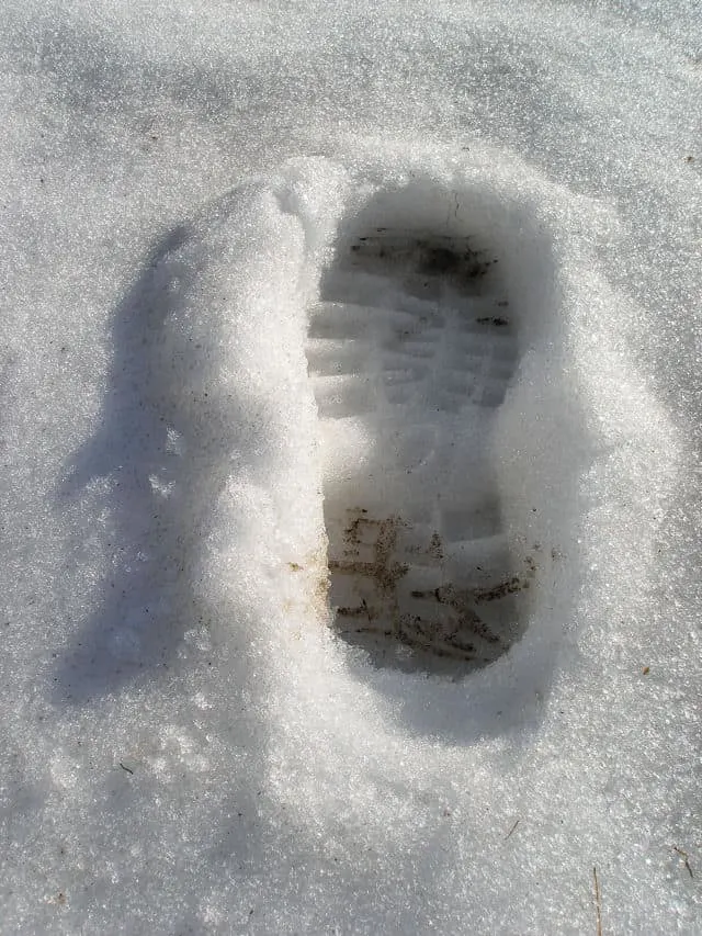 Boot print left in the snow.