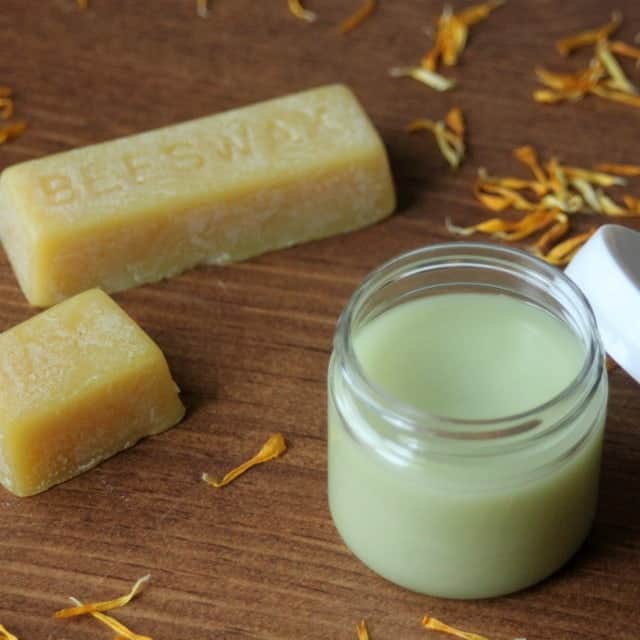 Soothe and nourish overworked hands and feet with the power of beeswax and natural ingredients in this DIY calendula cocoa butter balm.