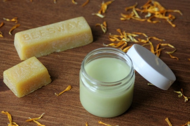 Soothe and nourish overworked hands and feet with the power of beeswax and natural ingredients in this DIY calendula cocoa butter balm.