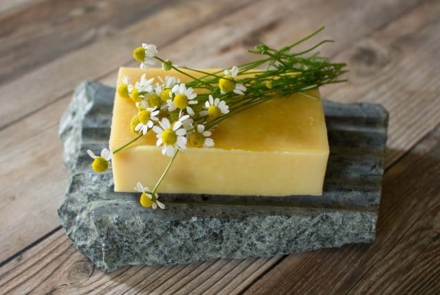 Use the garden to create skin nourishing and beautiful handmade chamomile carrot soap with this simple and natural recipe.