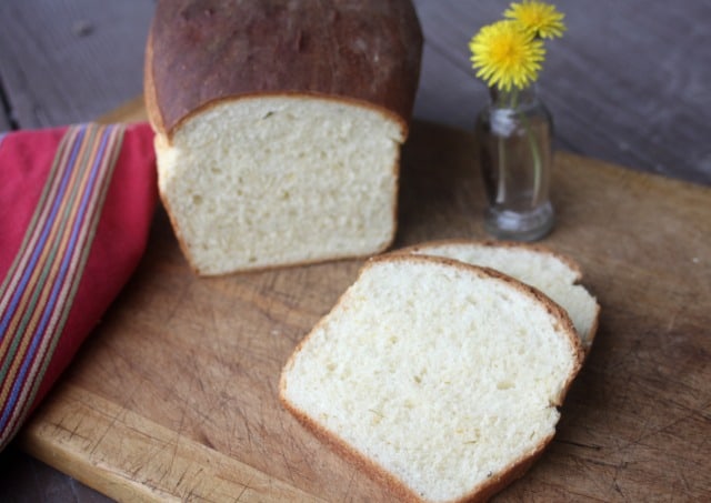 Dandelion bread sliced on a cutting board.