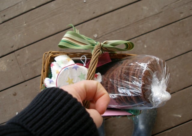 Gift basket with homemade cookies being hand delivered