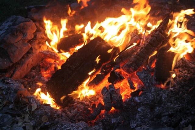 Resting by the campfire for summer self-care.