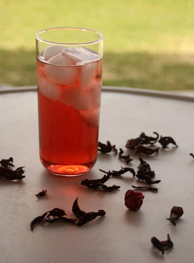 a glass of homemade iced tea on a table. 