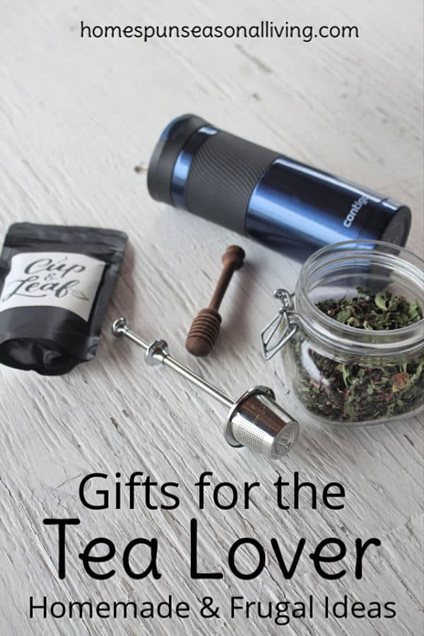 A collection of teas, tea ball, travel mug, and honey dipper for gifts for the tea lover.