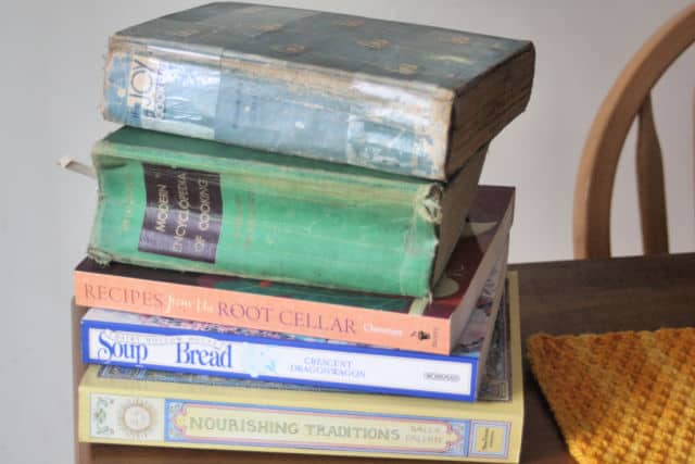 A stack of old and new cookbooks.