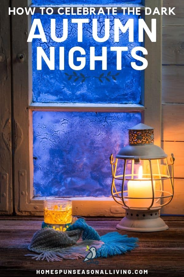 Candles in front of a frosted window at dusk