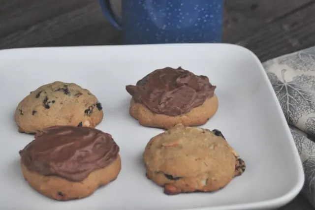 Hermit cookies with and without chocolate frosting on a plate.