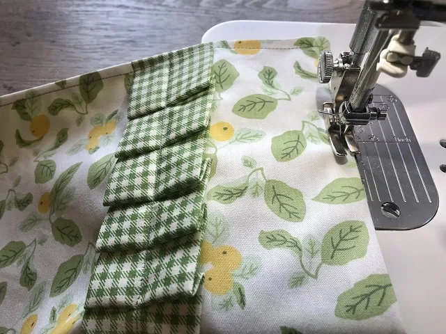 Sewing machine top stitching around clothespin bag