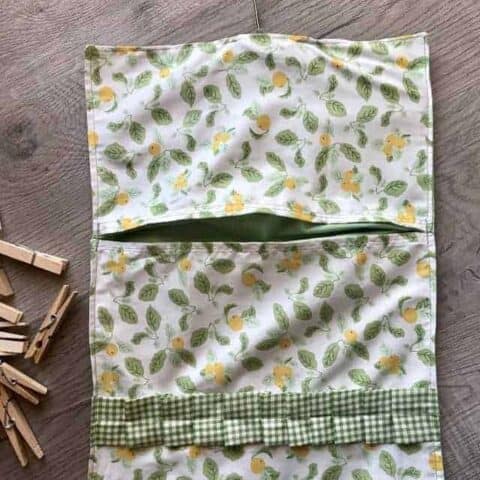 Completed DIY clothespin bag with lemons fabric and gingham ruffle