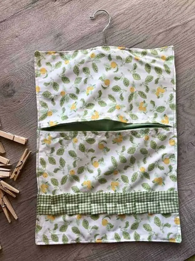 Completed DIY clothespin bag with lemons fabric and gingham ruffle