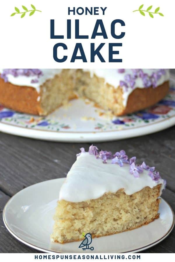 A slice of frosted lilac honey cake on a white plate sitting in front of the entire cake on a floral cake plate. 