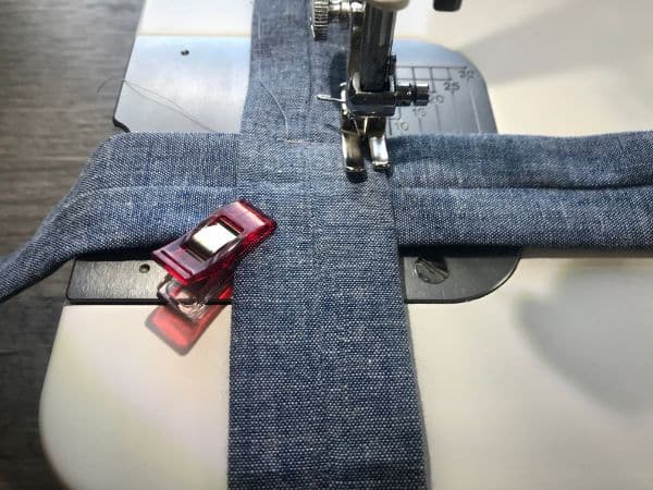 Sewing the fabric strips together with a sewing machine