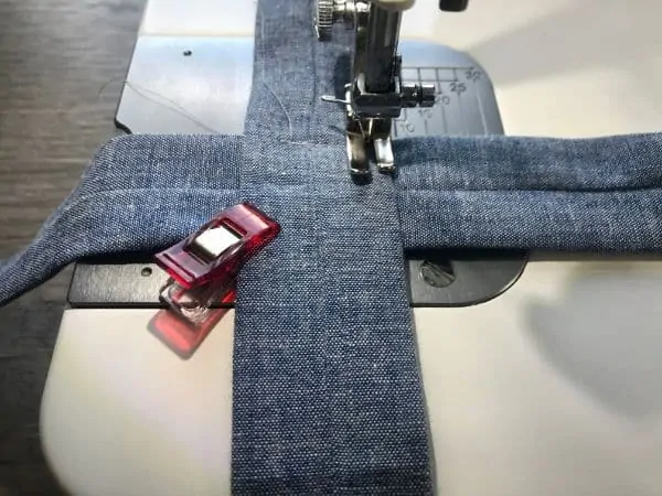 Sewing the fabric strips together with a sewing machine