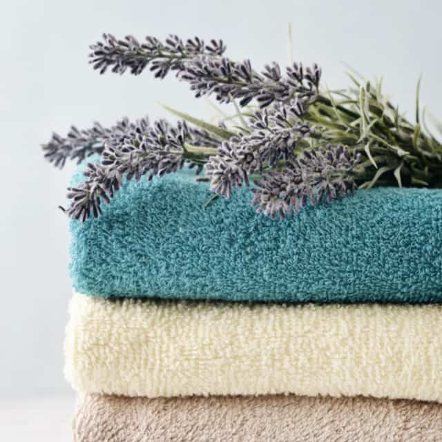 Stack of bath towels with lavender flowers