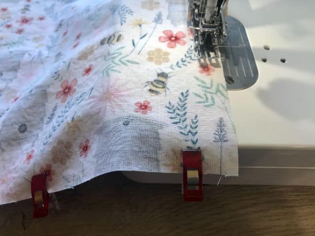 Sewing machine stitching around placemat