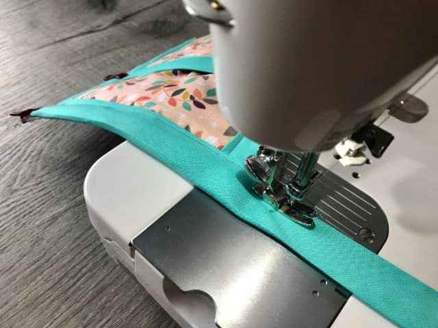 Sewing machine sewing tail of bias tape