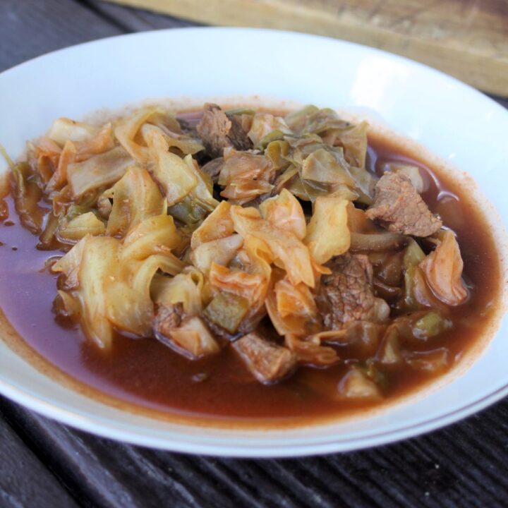 A bowl of cabbage and beef soup.