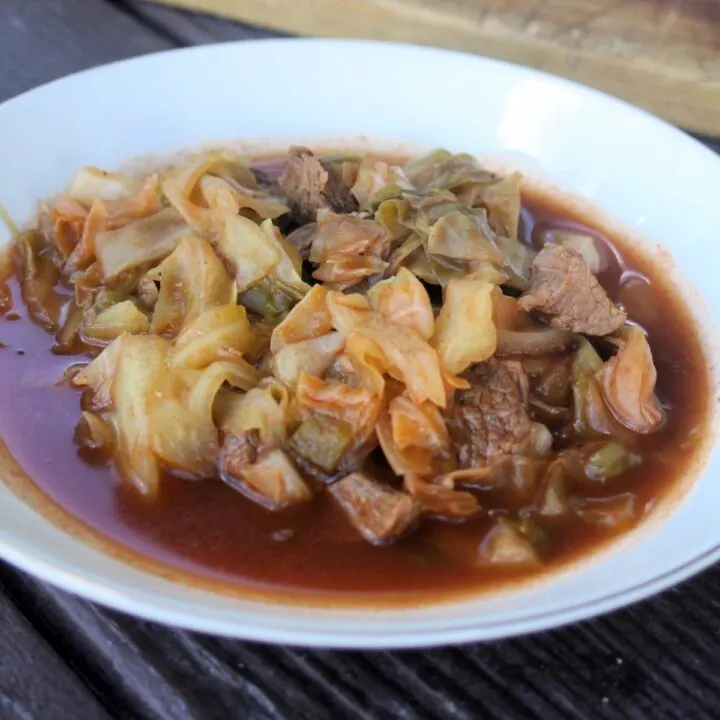 A bowl of cabbage and beef soup.