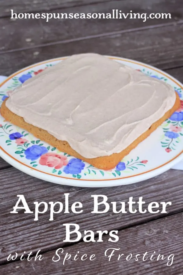 A pan of uncut Frosted Apple Butter Bars on a floral cake plate with text overlay.