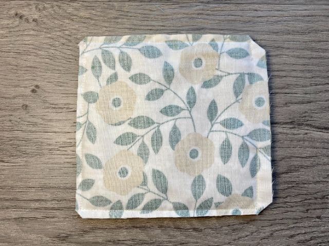 wrong side of fabric square with corners cut off