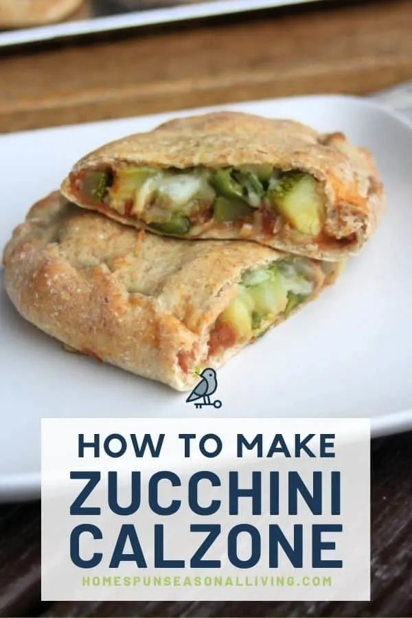 A zucchini calzone sliced in half exposing the vegetables inside the dough on a white plate with text overlay stating: how to make zucchini calzone.
