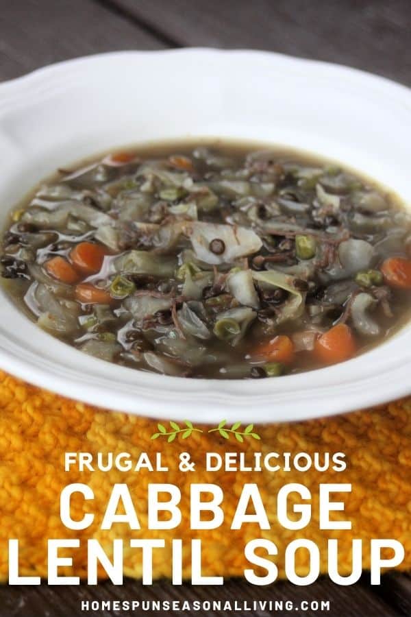 A white bowl full of cabbage lentil soup sitting on an orange table runner with text overlay stating: frugal & delicious cabbage lentil soup.