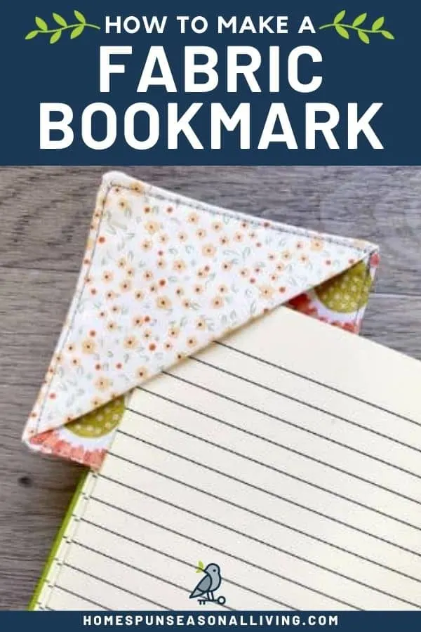 A fabric bookmark on the corner of black journal page with text overlay reading how to make a fabric bookmark.