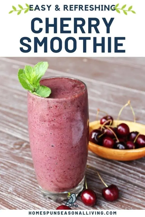 A drinking glass full of cherry smoothie with a sprig of fresh mint on top surrounded by fresh cherries with text overlay reading: easy & refreshing cherry smoothie.