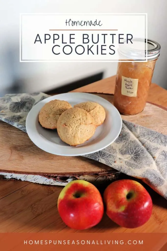 Cookies on a white plate that is sitting on a napkin, a jar of apple butter sits in the background. Text overlay reads: Homemade Apple Butter Cookies.