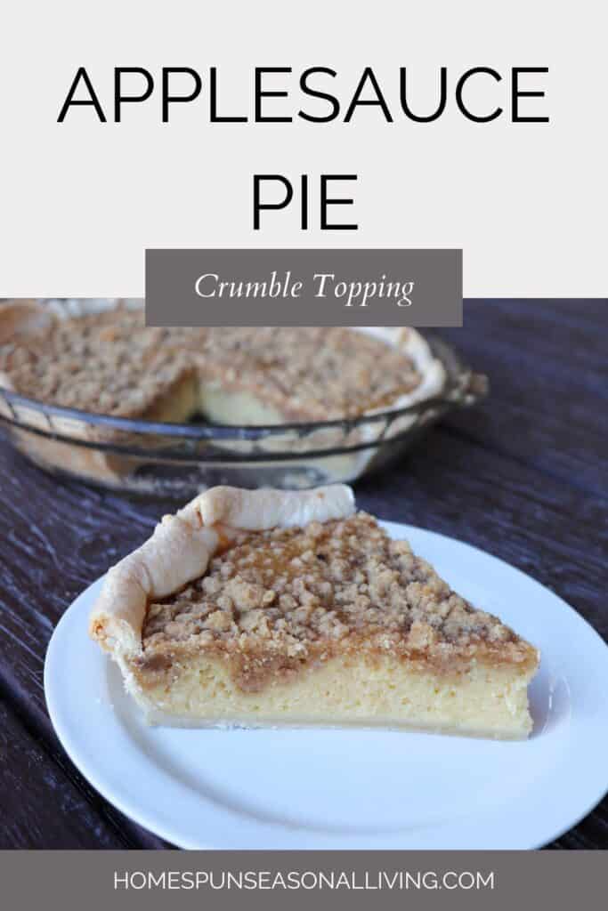 A slice of pie with crumble topping on a plate with the remaining pie in the background. Text overlay reads: Applesauce Pie Crumble Topping.