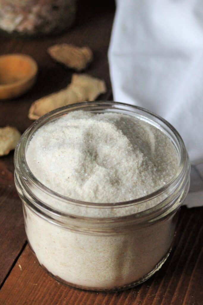 Close up of ginger bath salts in an open jar. 