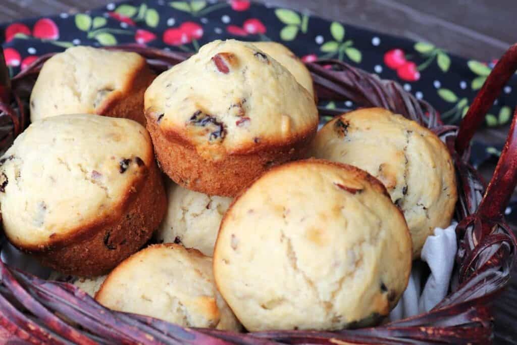 A wicker basket full of homemade muffins.