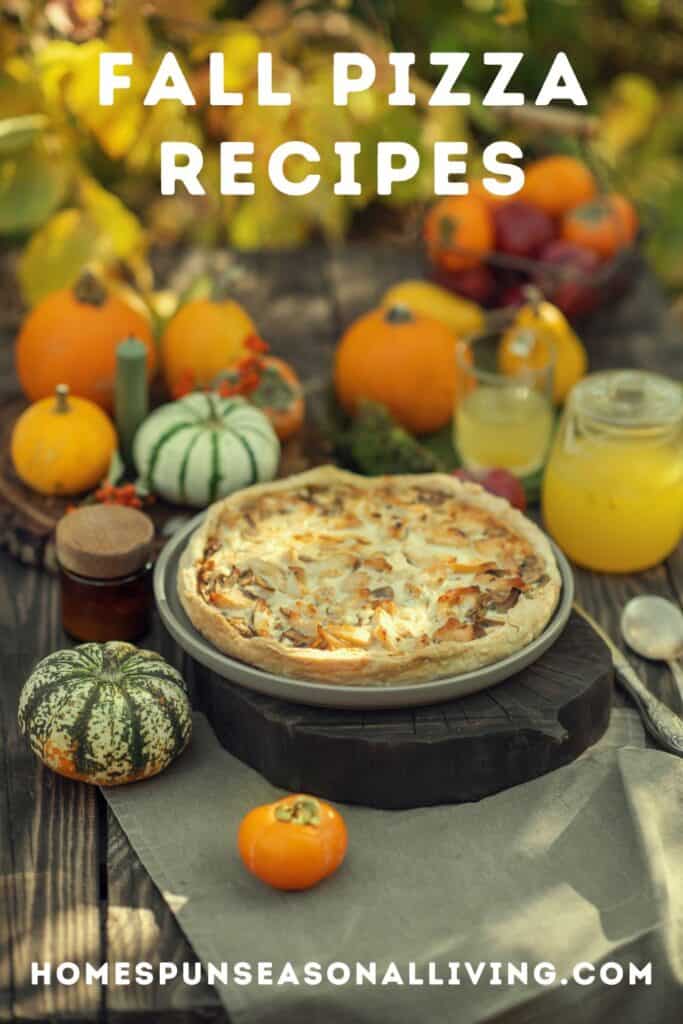 A pizza sits on a board surrounded by winter squashes and pitchers of drinks. Text overlay reads: Fall Pizza Recipes. 