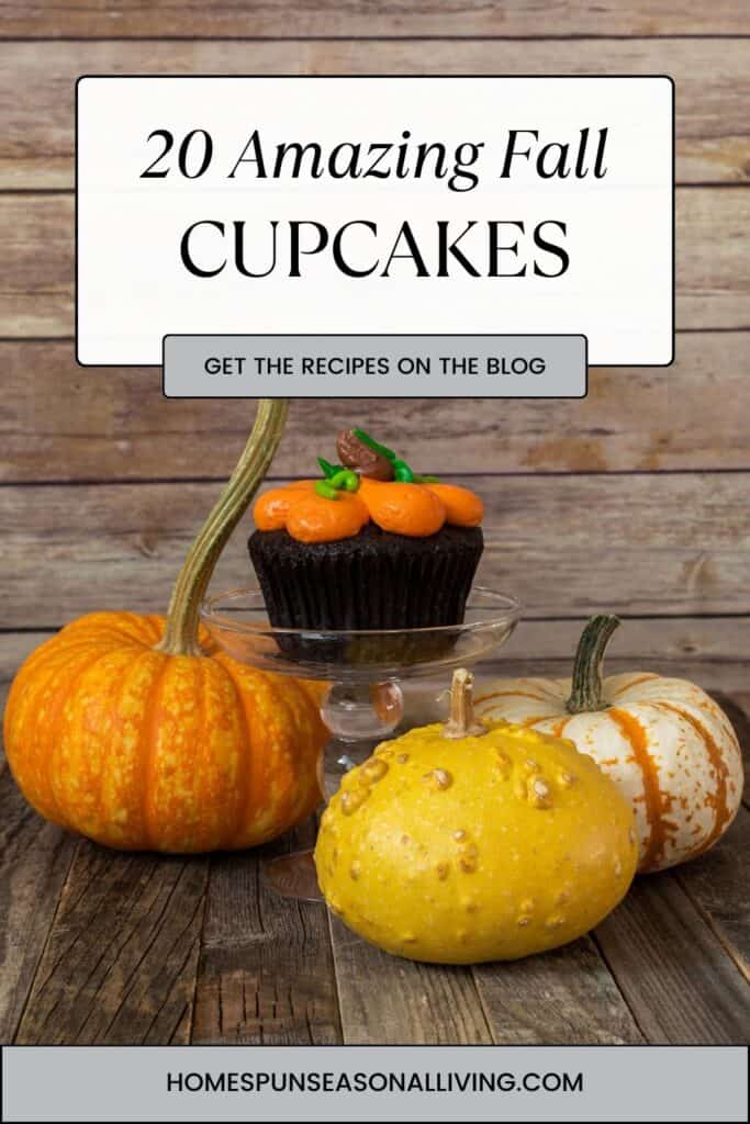A chocolate cupcake with orange colored frosting sits on a plate surrounded by fresh pumpkins. Text overlay reads: 20 amazing fall cupcakes.