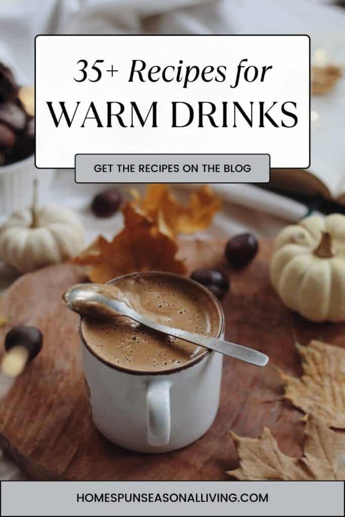 A mug of hot cocoa sits on a table with a spoon on top. Text overlay reas 35+ recipes for warm drinks. 