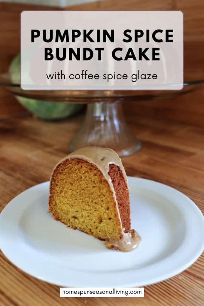 A slice of glazed bundt cake sits on a plate. Behind it is a glass cake plate on a pedestal with the remaining cake and a blue hubbard squash. Text overlay reads: Pumpkin Spice Bundt Cake with coffee spice glaze.